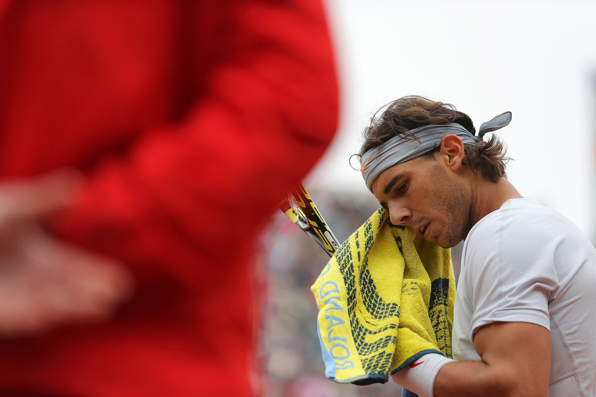 Nadal of Spain wipes his face during his men's singles final