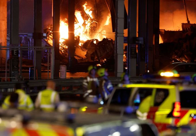 Flames are seen as emergency services respond to a fire in Terminal Car Park 2 at London Luton airport in Luton, Britain, October 10, 2023.  REUTERS/Peter Cziborra