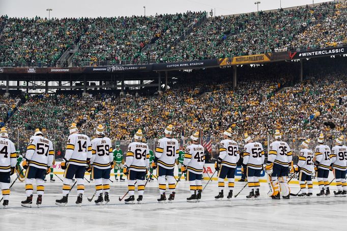 Jan 1, 2020; Dallas, TX, USA; Nashville Predators players stand for the national anthem before the 2020 Winter Classic hockey game against the Dallas Stars at Cotton Bowl