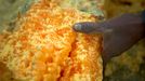 Miner holding a hardened piece of sulfur Sulfur miners in Eastern Java's famous sulfur-belching Ijen crater rely on their sheer muscle power to mine sulfur in some of the