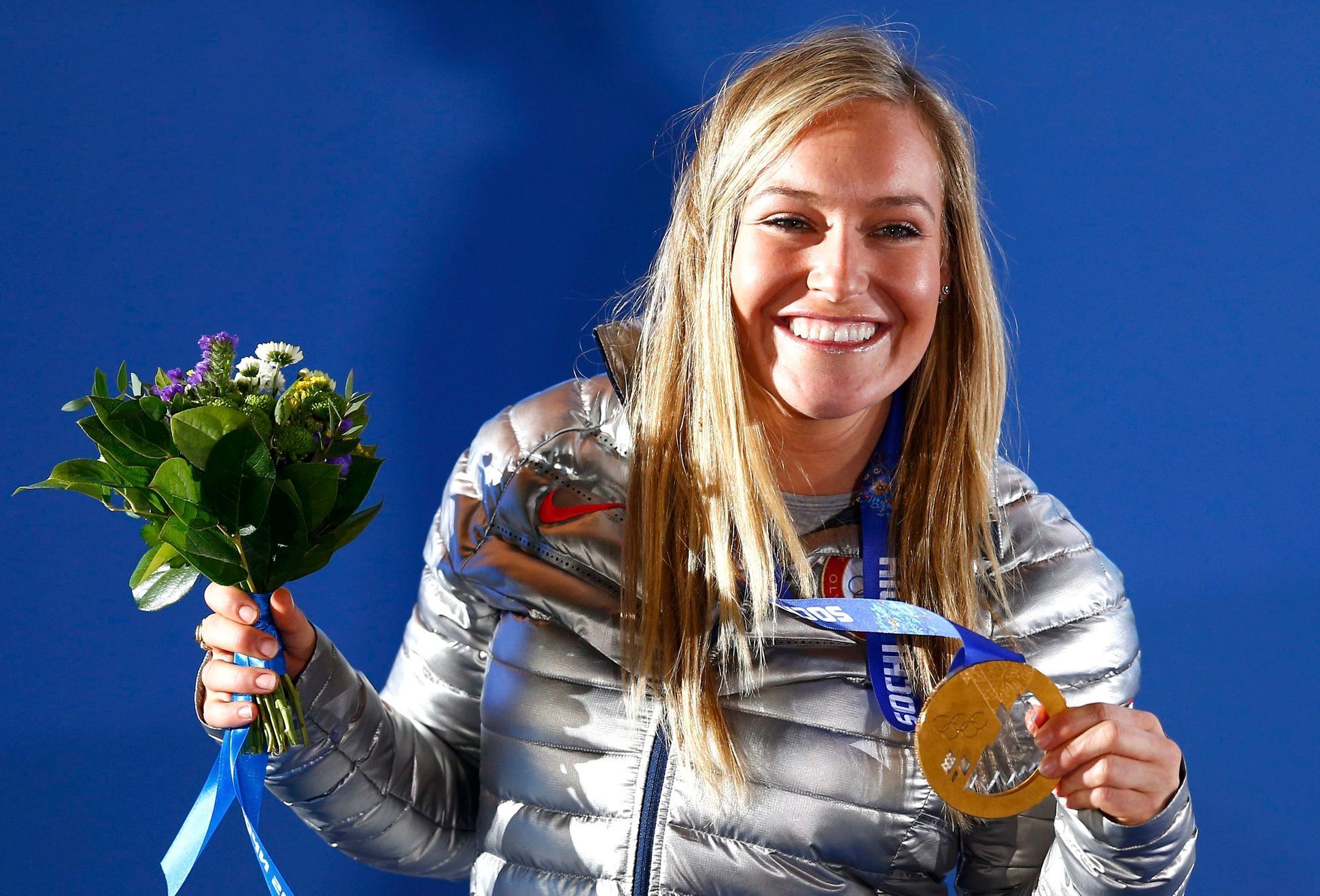 Gold medalist Jamie Anderson of the U.S. poses on the podium at the medal ceremony after the women's snowboard slopestyle event at the