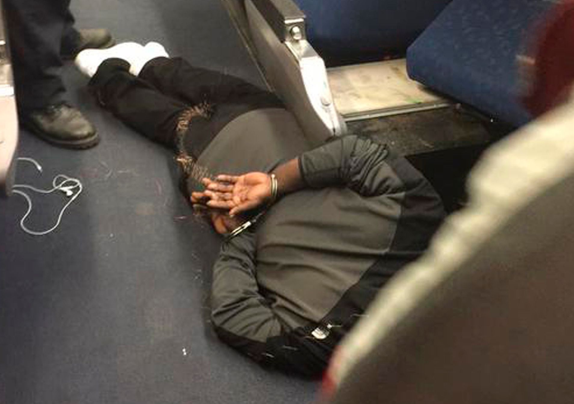 A man is seen in custody aboard an Amtrak train following a stabbing incident in Niles, Michigan