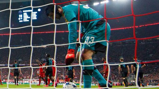 Arsenal's Petr Cech looks dejected after Thomas Muller scored the second goal for Bayern Munich