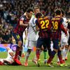 Barcelona's Busquets steps on Real Madrid's Pepe after a Messi goal against Real Madrid during La Liga's second 'Clasico' soccer match of the season in Madrid