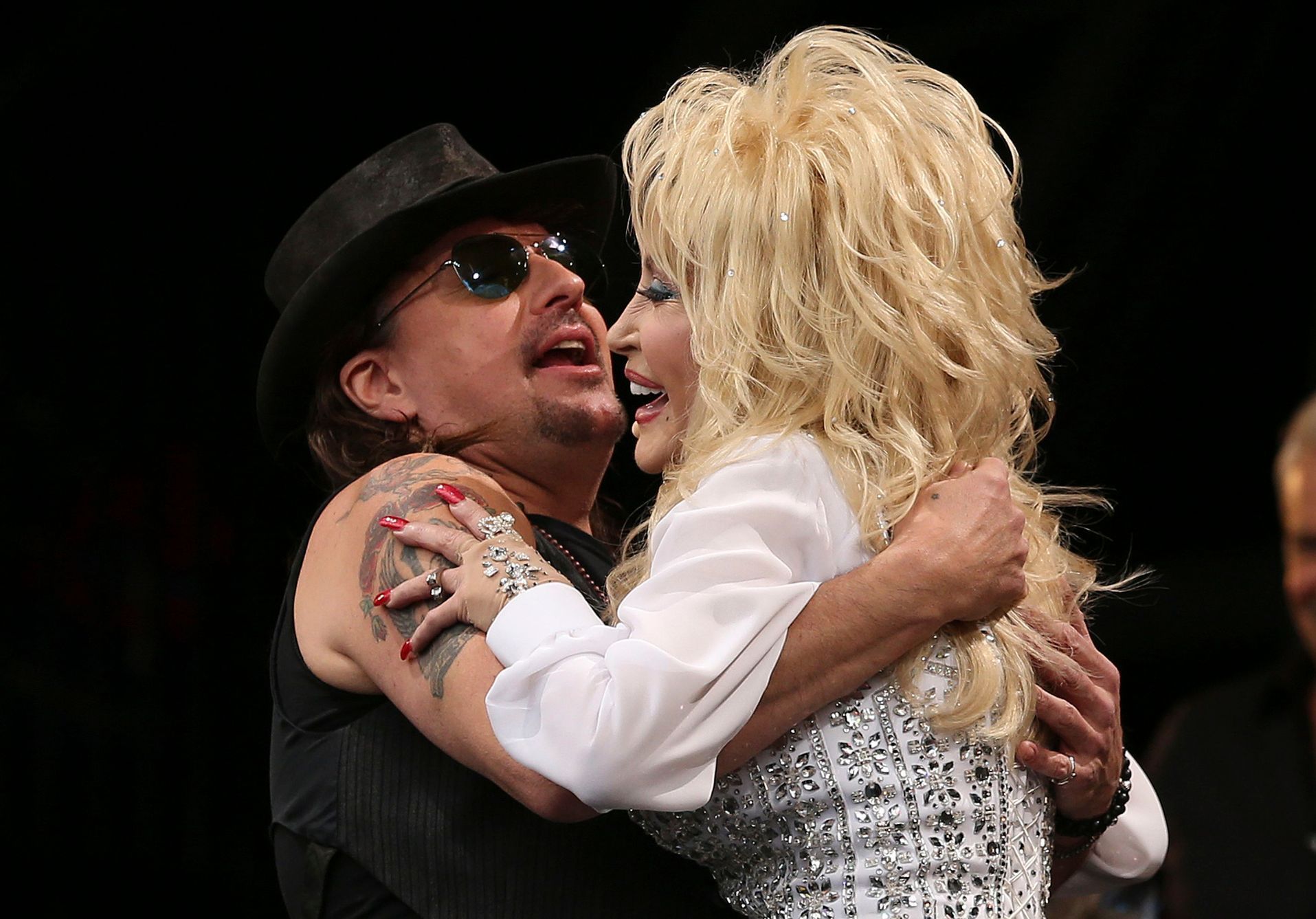 Sambora greets Parton to perform on the Pyramid Stage at Worthy Farm in Somerset, during the Glastonbury Festival