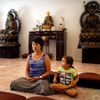 Sarah Kim meditates with Sabina Mayorga at Lu Mountain Buddhist Temple in Rosemead