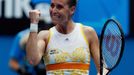 Flavia Pennetta of Italy celebrates defeating Monica Puig of Puerto Rico in their women's singles match at the Australian Open 2014 tennis tournament in Melbourne January