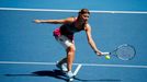 Lucie Safarova of the Czech Republic hits a return to Li Na of China during their women's singles match at the Australian Open 2014 tennis tournament in Melbourne