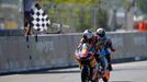 KTM Moto3 rider Jack Miller of Australia (L) crosses the finishing line ahead of Honda Moto3 rider Alex Rins of Spain during the French Grand Prix in Le Mans circuit, May