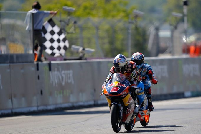 KTM Moto3 rider Jack Miller of Australia (L) crosses the finishing line ahead of Honda Moto3 rider Alex Rins of Spain during the French Grand Prix in Le Mans circuit, May