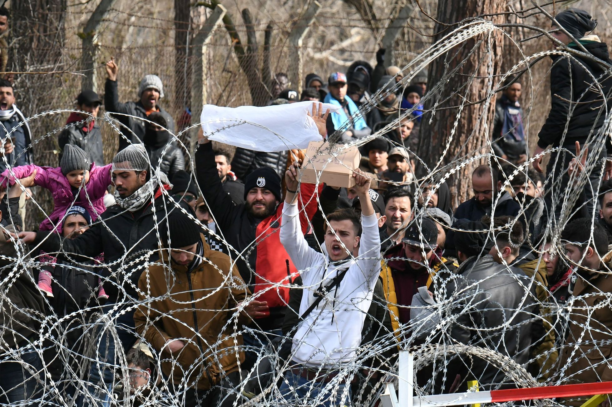 Migranti na řecko-turecké hranici.