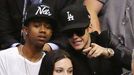 Singer Justin Bieber (R) sits in the crowd as he attends Game 7 of the Western Conference semi-final hockey playoff between the Los Angeles Kings and the San Jose Sharks