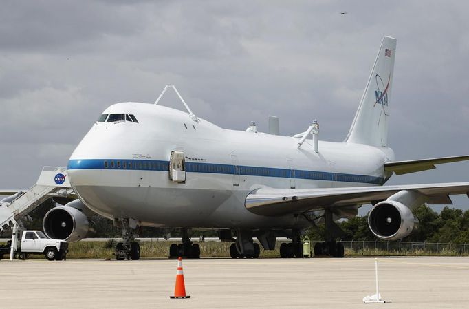 A converted NASA 747 aircraft stands by to be mated with the space shuttle Discovery at Kennedy Space Center in Cape Canaver