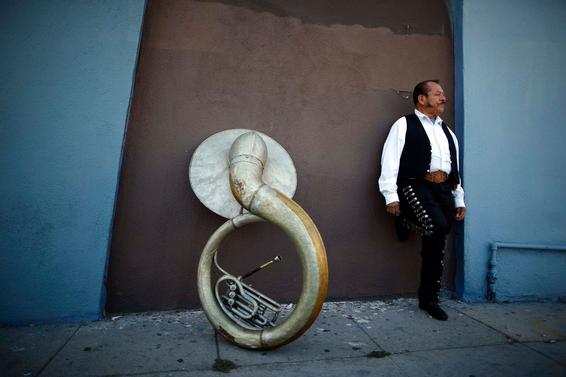 Mariachi musician Moises Rivera waits for a gig in the Boyle Heights area of Los Angeles