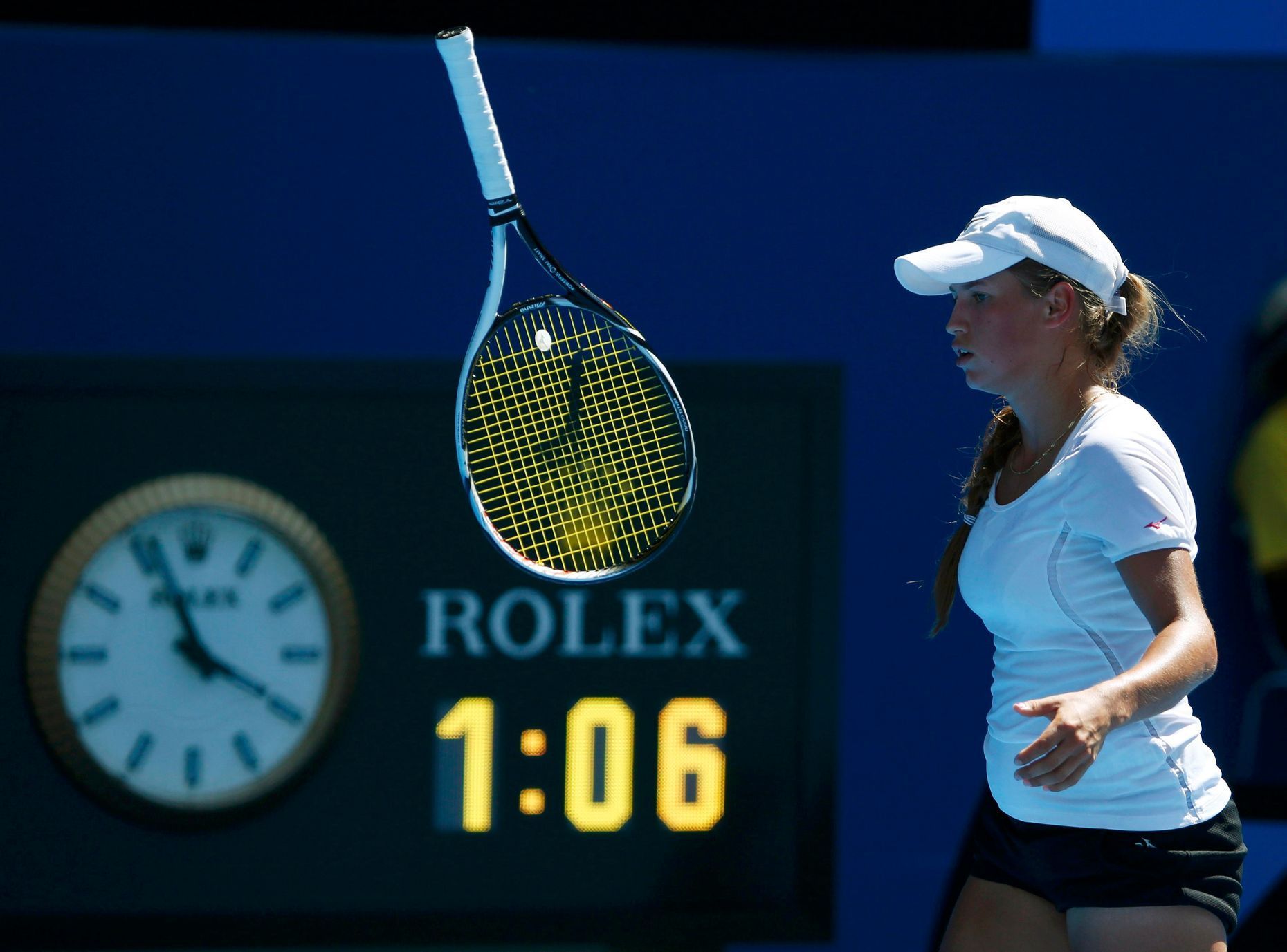 Agnieszka Radwanska of Poland bounces her racquet during her women's singles match against Yulia Putintseva of Kazakhstan at the Australian Open 2014 tennis tournament in Melbourne