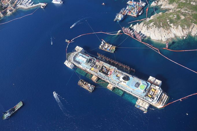 An aerial view of the Costa Concordia cruise liner is photographed from an Italian Civil Protection plane during the refloat operation at Giglio harbour at Giglio Island,