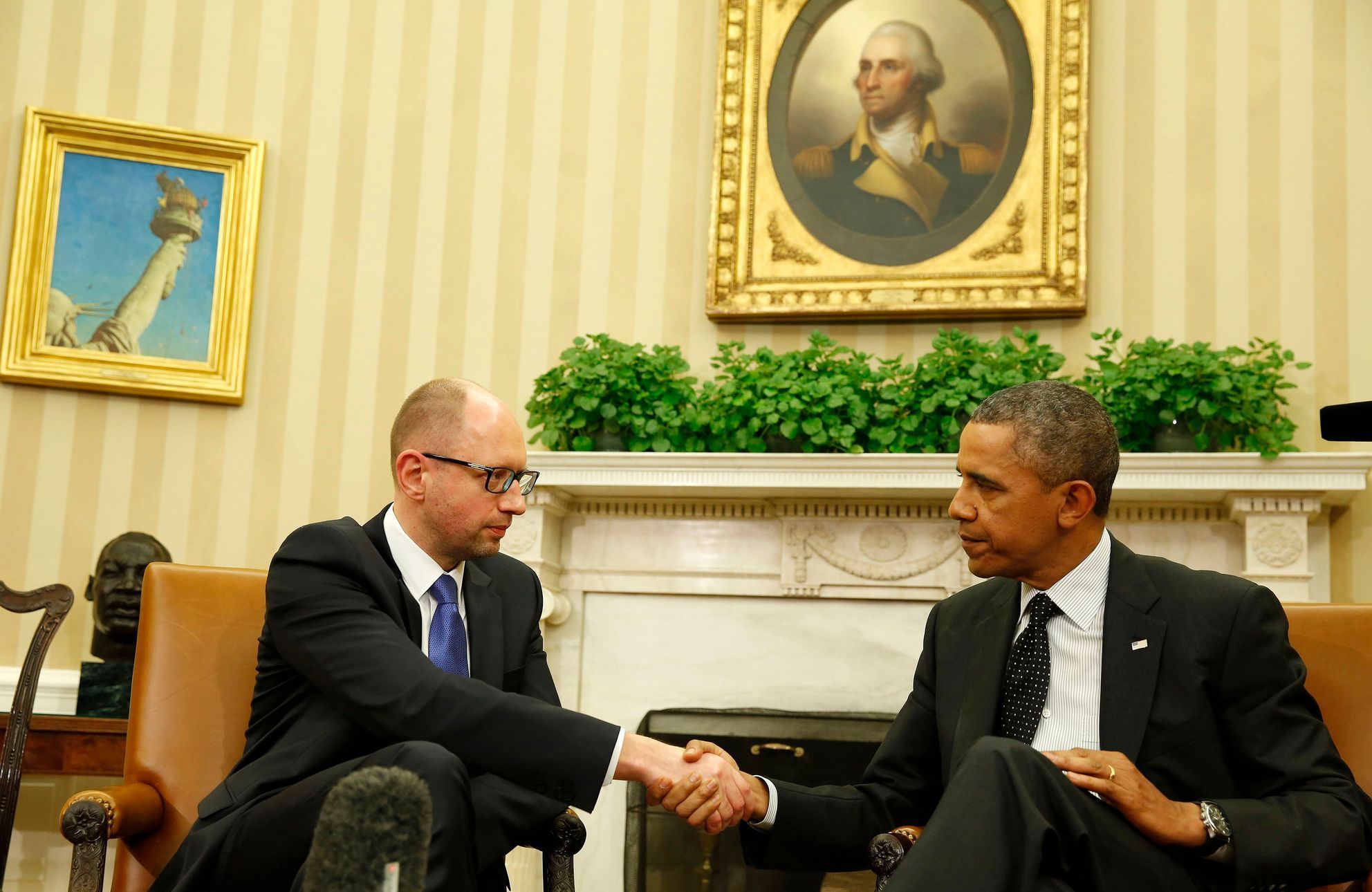U.S. President Barack Obama shakes hands as he hosts a meeting with Ukraine Prime Minister Arseniy Yatsenyuk in the Oval Office of the White House in Washington
