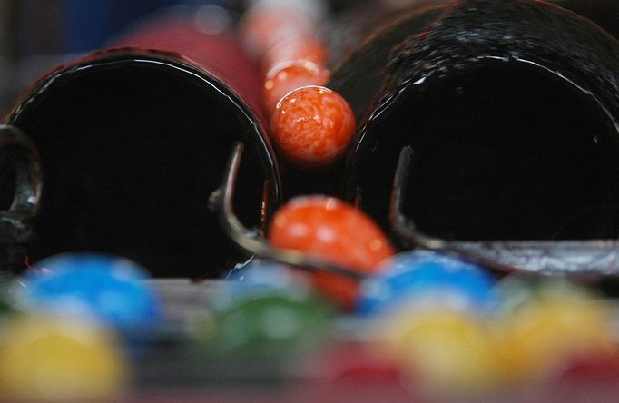 Eggs are being colored on a roller on March 30, 2012 at the egg dye factory in Thannhausen, southern Germany. During the Easter season, the plant produces daily around 180,000 hard-boiled and dyed eggs.