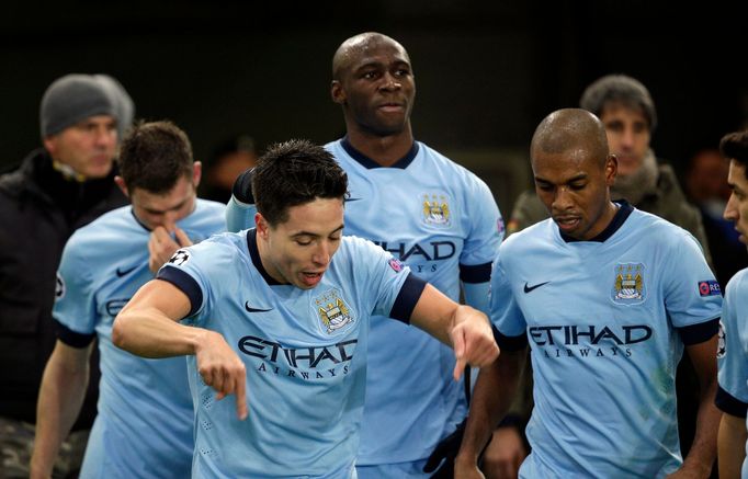 Manchester City's Nasri celebrates after scoring against AS Roma during their Champions League Group E soccer match at the Olympic stadium in Rome