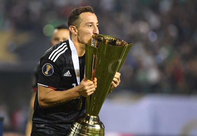 Jul 7, 2019; Chicago, IL, USA; Mexico midfielder Andres Guardado (18) kisses the Gold Cup after defeating the United States in the championship match of the CONCACAF Gold