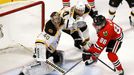 Chicago Blackhawks' Patrick Kane (88) loses control of the puck while attempting a shot on Boston Bruins goalie Tuukka Rask as Bruins' Dennis Seidenberg (44) defends duri