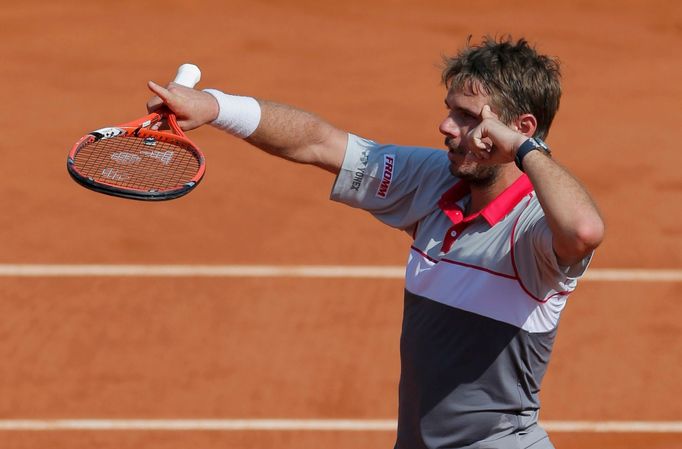 Stan Wawrinka of Switzerland celebrates after defeating Jo-Wilfried Tsonga of France during their men's semi-final match at the French Open tennis tournament at the Rolan