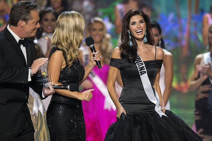 Miss Photogenic winner Miss Indiana USA Reece reacts on stage during the 2015 Miss USA beauty pageant in Baton Rouge, Louisiana