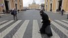 A woman crosses the street in front of Saint Peter's Square at the Vatican March 10, 2013. Roman Catholic cardinals will enter a conclave to elect a successor to Pope Benedict on March 12, the Vatican said on Friday, with no clear favorite emerging so far to take charge of the troubled Church. REUTERS/Eric Gaillard (VATICAN - Tags: RELIGION SOCIETY POVERTY) Published: Bře. 10, 2013, 2:09 odp.