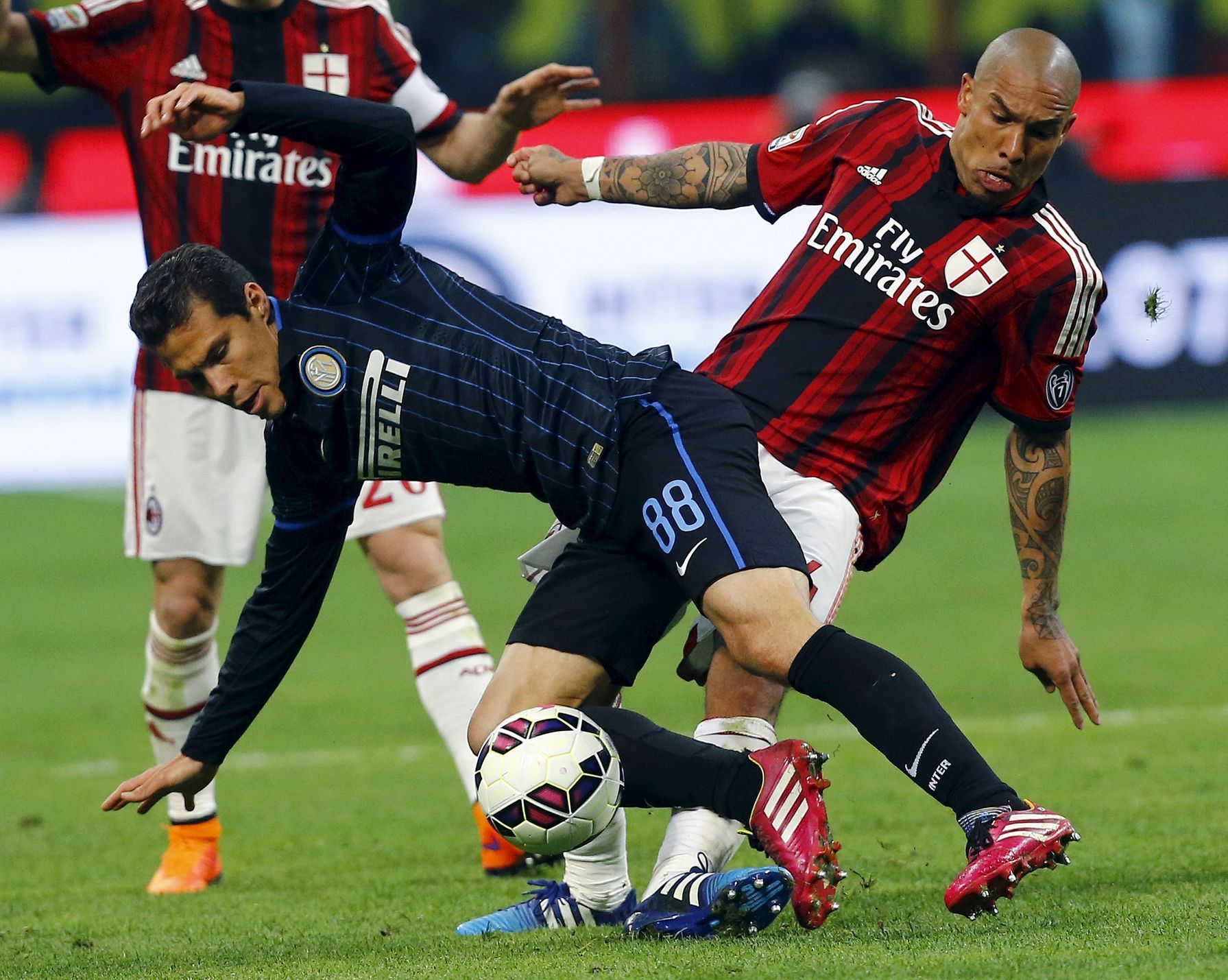 AC Milan's De Jong challenges Inter Milan's Hernanes during their Serie A soccer match at the San Siro stadium in Milan