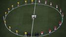 Brazil and Croatia players stand in a circle as doves (C) are released before kickoff at the 2014 World Cup opening match at the Corinthians arena in Sao Paulo June 12, 2