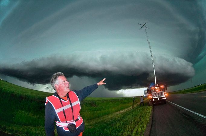 VORTEX 2 - Tornado Researcher Herbert Stein Herbert Stein, tornado researcher and driver of the Doppler on Wheels (DOW) portable weather radar truck, gestures toward a rapidly approaching supercell thunderstorm in western Nebraska on June 6, 2010. The DOW played a crucial role in the success of VORTEX 2, an unprecedented two-year science project to study tornadoes in the United States in 2009 and 2010.