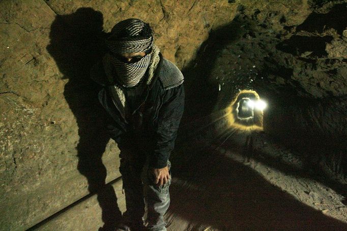 Rafah, Palestinian Territory. 19th February 2013 -- A Palestinian works inside a smuggling tunnel, beneath the Egyptian-Gaza border in Rafah, in the southern Gaza Strip. -- Egypt will not tolerate a two-way flow of smuggled arms with the Gaza Strip that is destabilising its Sinai peninsula, a senior aide to its Islamist president said, explaining why Egyptian forces flooded sub-border tunnels last week.