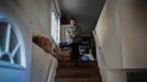 January Nuzzo poses for a photograph nine feet above the ground on the living level of her home which was destroyed by Hurricane Sandy in Staten Island November 12, 2012. Nuzzo was trapped with her one month old son, Lucas, when the 13 feet storm surge rose too quickly for her to escape. At least 23 New Yorkers were killed in this low-lying area of Staten Island where mostly one-story former beach bungalows were inundated by flooding. Picture taken November 12, 2012. REUTERS/Mike Segar (UNITED STATES - Tags: DISASTER ENVIRONMENT) ATTENTION EDITORS PICTURE 18 OF 19 FOR PACKAGE 'SURVIVING SANDY' SEARCH 'SEGAR SANDY' FOR ALL PICTURES Published: Lis. 20, 2012, 3:31 odp.