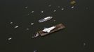 The Space Shuttle Enterprise floats up the Hudson River June 6, 2012, as it rides past the New York skyline on a barge to be placed at the Intrepid Sea, Air and Space Museum. REUTERS/Lucas Jackson (UNITED STATES - Tags: SCIENCE TECHNOLOGY TRANSPORT) Published: Čer. 6, 2012, 4:57 odp.