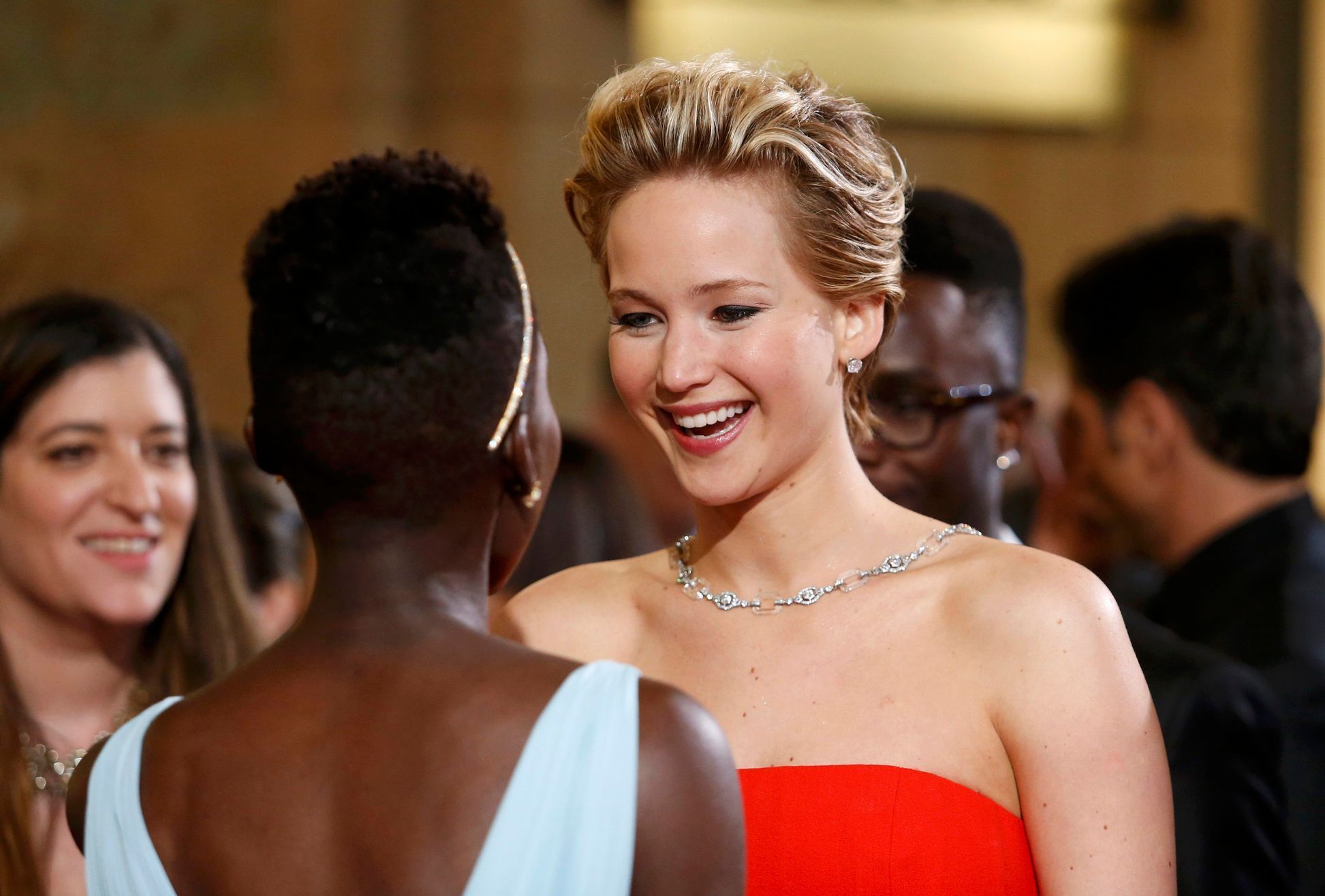Lawrence talks with Nyong'o at the 86th Academy Awards in Hollywood