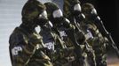 Brazilian army soldiers wearing chemical suits participate in an anti-terror simulation exercise as part of the preparation for the upcoming 2013 FIFA Confederations Cup in Brasilia. May 22, 2013. About 100 soldiers took part in the exercise which include preventive strikes against chemical, biological and radiological weapons conducted around Mane Garrincha National Stadium, according to an official statement. REUTERS/Ueslei Marcelino (BRAZIL - Tags: SPORT SOCCER MILITARY) Published: Kvě. 22, 2013, 9:46 odp.