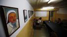 A painting of Mongolian national hero Genghis Khan hangs in the headquarters of the Mongolian neo-Nazi group Tsagaan Khass in Ulan Bator June 22, 2013. The group has rebranded itself as an environmentalist organisation fighting pollution by foreign-owned mines, seeking legitimacy as it sends Swastika-wearing members to check mining permits. Over the past years, ultra-nationalist groups have expanded in the country and among those garnering attention is Tsagaan Khass, which has recently shifted its focus from activities such as attacks on women it accuses of consorting with foreign men to environmental issues, with the stated goal of protecting Mongolia from foreign mining interests. This ultra-nationalist group was founded in the 1990s and currently has 100-plus members. Picture taken June 22, 2013. REUTERS/Carlos Barria (MONGOLIA - Tags: POLITICS ENVIRONMENT BUSINESS SOCIETY EMPLOYMENT) ATTENTION EDITORS: PICTURE 14 OF 25 FOR PACKAGE 'MONGOLIA'S ENVIRONMENTAL NEO-NAZIS'. TO FIND ALL IMAGES SEARCH 'TSAGAAN KHASS' Published: Čec. 2, 2013, 9:58 dop.