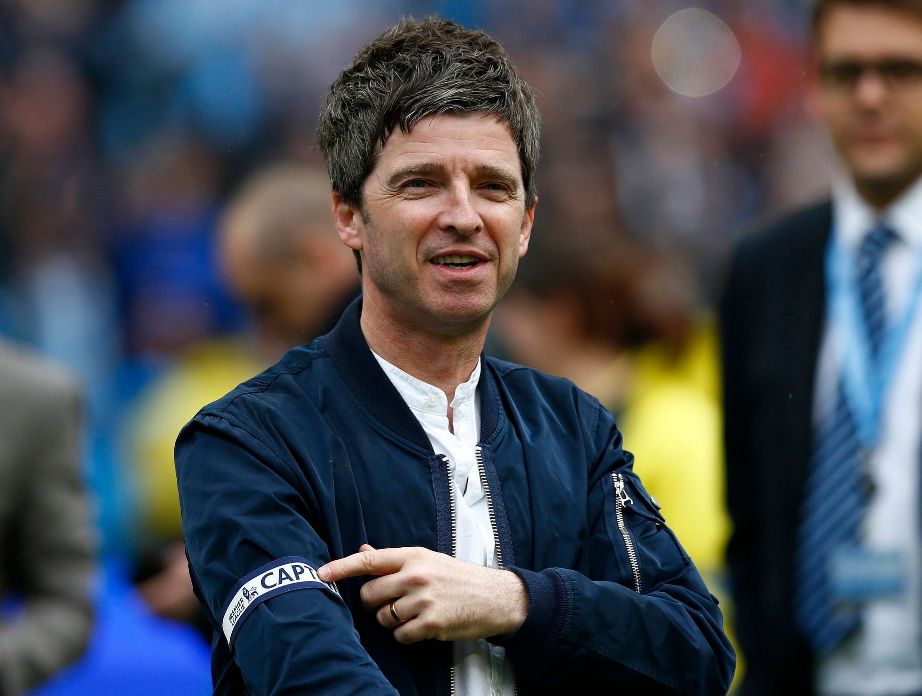 Noel Gallagher singer and Manchester City fan shows off the captains' arm band, given to him by Vincent Kompany,  following their soccer match against West Ham United at the Etihad Stadium in Manchest