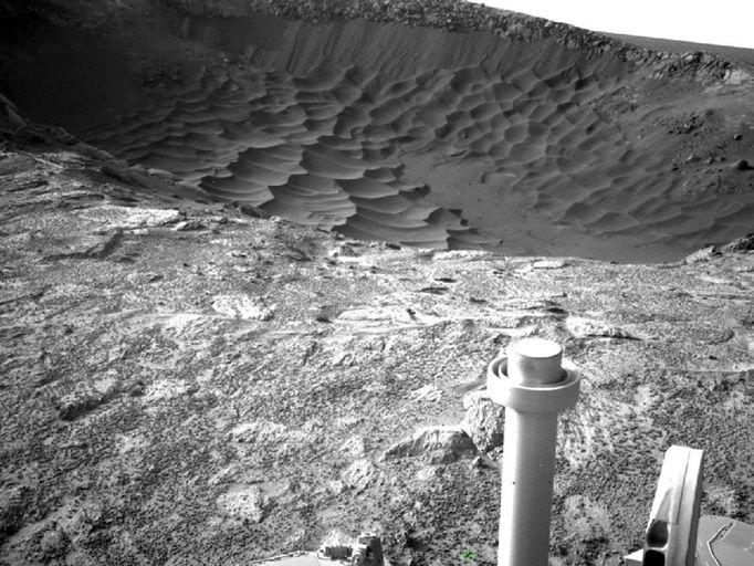 Textures of 'Santa Maria' Crater, Sol 2476 This image from NASA's Mars Exploration Rover at the edge of "Santa Maria" crater shows diverse textures of the crater. Contrast has been enhanced to emphasize the textures. Opportunity used its navigation camera to record this view during the 2,476th Martian day, or sol, of the rover's work on Mars (Jan. 10, 2011). The rover's position was close to the crater's lip on the southeastern edge of the crater. Santa Maria is about 90 meters (295 feet) in diameter. NASA's Jet Propulsion Laboratory, a division of the California Institute of Technology in Pasadena, manages the Mars Exploration Rover Project for the NASA Science Mission Directorate, Washington. Image Credit: NASA/JPL-Caltech