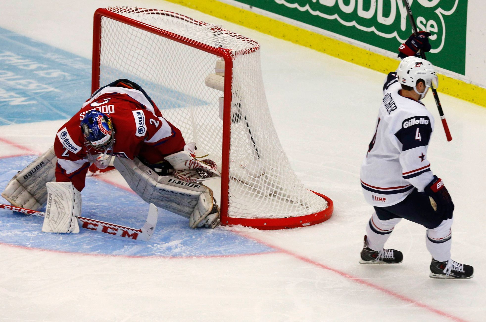 Butcher of the U.S. scores on Czech Republic's goalie Dolejs during their IIHF World Junior Championship ice hockey game in Malmo