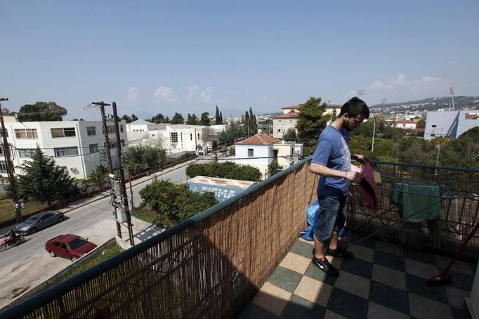 Thanos Kehagias hangs out laundry at his student flat in the Greek city of Patra