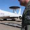 The patch of the NATO AWACS aircraft is seen attached to the uniform of an officer before boarding for a surveillance flight over Romania from the AWACS air base in Geilenkirchen near the German-Dutch