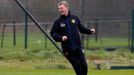 Manchester United's manager Moyes smiles during a training session at the club's Carrington training complex in Manchester