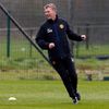 Manchester United's manager Moyes smiles during a training session at the club's Carrington training complex in Manchester