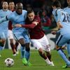 AS Roma's Francesco Totti is challenged by Manchester City's Eliaquim Mangala (L) during their Champions League Group E soccer match in Rome