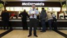 Marcin Lubowicki, a 28 year-old deputy manager of a McDonald's restaurant, poses with his university diploma in front of the fast food chain in the Arkadia shopping mall, Warsaw May 16, 2012. Lubowicki, who has degree in Russian language from Warsaw University, has been working for McDonald's since 2007. He is planning to stay in his job.