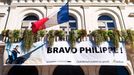 Town Hall / "Hotel de Ville" administration building, with Philippe Croizon / disabled sportsman banner - France. Philippe Croizon (born 1968) is a French athlete and the first quadruple amputee to swim across the English Channel. His amputations were required due to a severe electric shock accident which occurred in March 1994. In April 2012, Croizon announced a project to swim the four straits separating the five continents, in which he would be accompanied by long-distance swimmer Arnaud Chassery. The planned trips included Australia to Asia; across the Red Sea (linking Asia and Africa); the Straits of Gibraltar (linking Africa and Europe); and the Bering Strait (linking Asia and America).