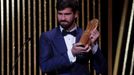 Soccer Football - The Ballon d’Or awards - Theatre du Chatelet, Paris, France - December 2, 2019  Liverpool's Alisson Becker with the Yachine Trophy  REUTERS/Christian Ha