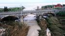 The swollen Milicia river runs in the area where nine people lost their lives when their home was flooded in Casteldaccia, near Palermo.