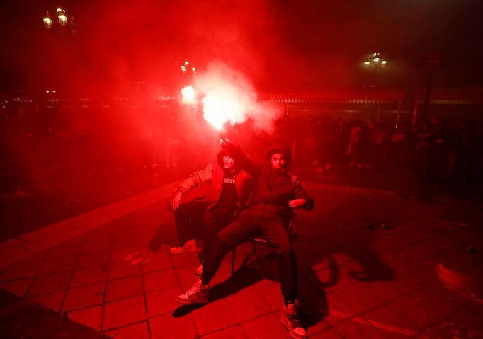 Soccer Football - FIFA World Cup Qatar 2022 - Fans in Nice watch France v Morocco - Nice, France - December 14, 2022 France fans with a flare as they celebrate reaching t